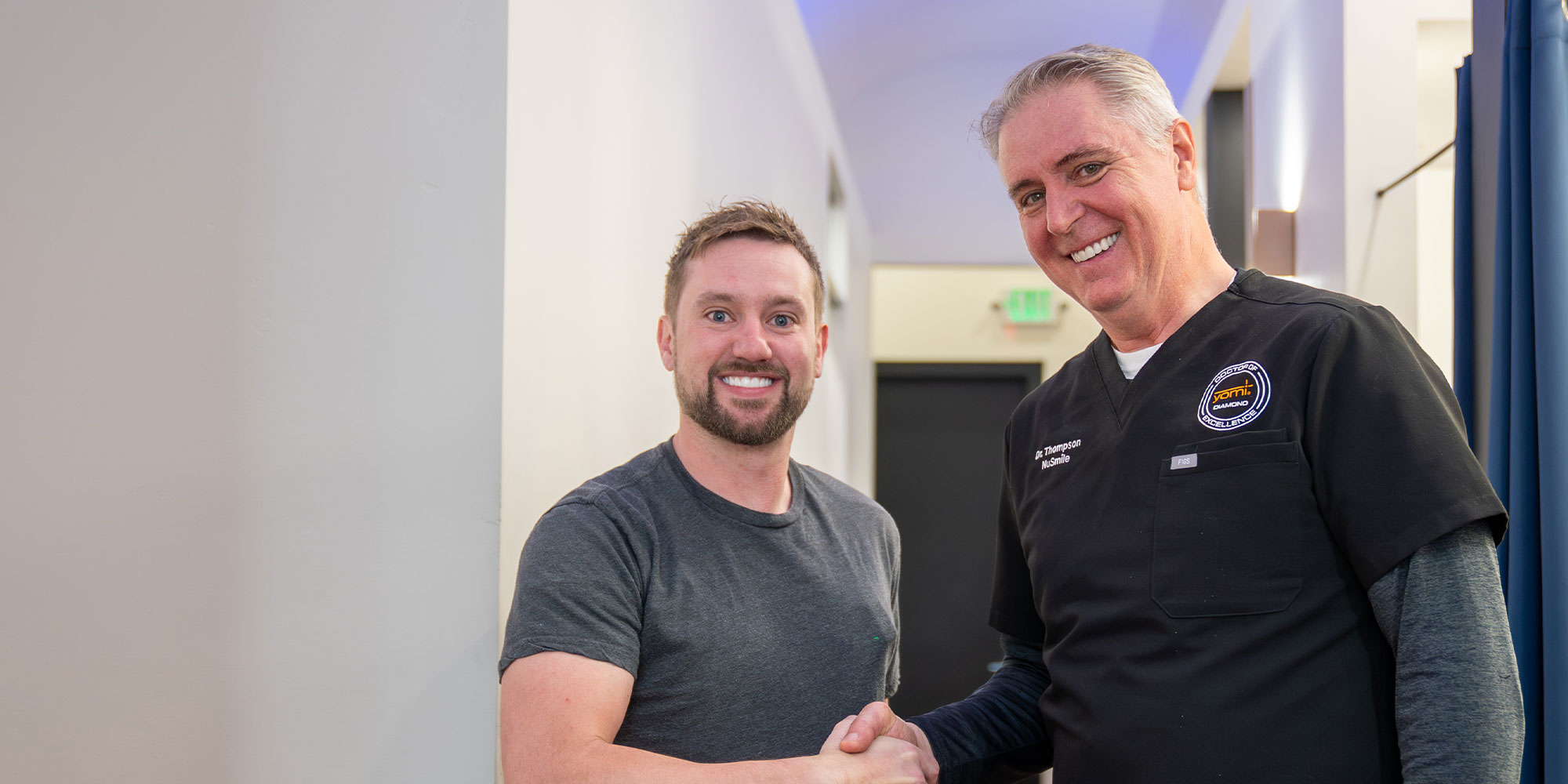 dr thompson with patient shaking hands